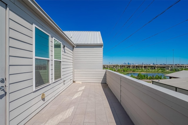 balcony featuring a water view