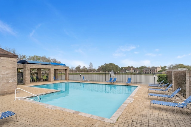 community pool featuring a patio area and fence