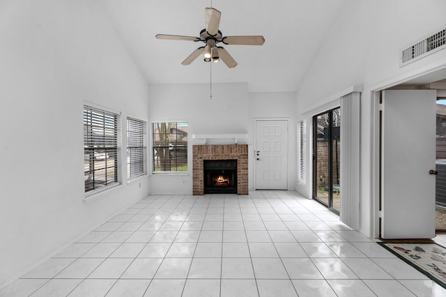 unfurnished living room featuring light tile patterned floors, a ceiling fan, visible vents, a brick fireplace, and high vaulted ceiling