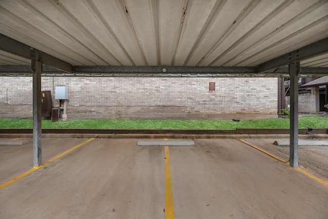 view of car parking with a parking garage
