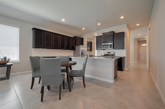 dining space with light tile patterned flooring, visible vents, baseboards, and recessed lighting