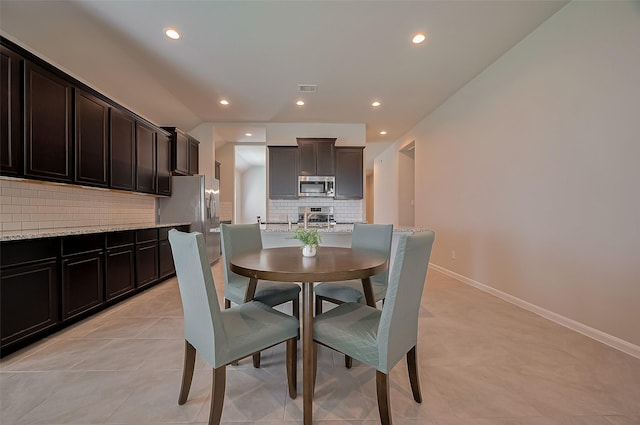 dining room with baseboards, visible vents, recessed lighting, and light tile patterned floors