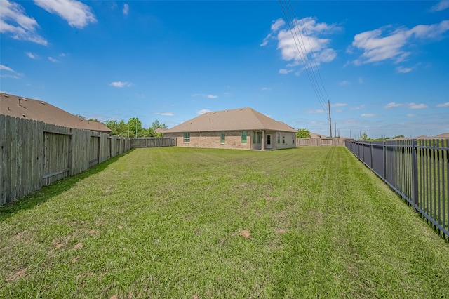 view of yard featuring a fenced backyard