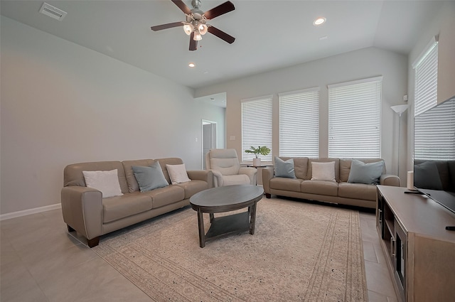 living room featuring visible vents, baseboards, ceiling fan, and light tile patterned floors