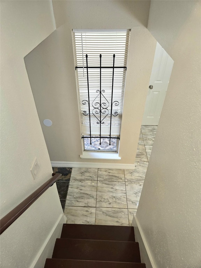 12325 Ridgeside Dr, Houston, TX 77072 - staircase featuring marble finish floors and baseboards