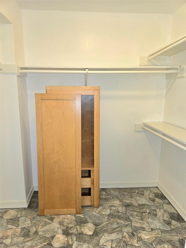 12325 Ridgeside Dr, Houston, TX 77072 - walk in closet with stone finish floors