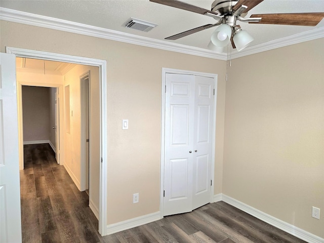 12325 Ridgeside Dr, Houston, TX 77072 - unfurnished bedroom featuring attic access, dark wood-style flooring, ornamental molding, a closet, and baseboards