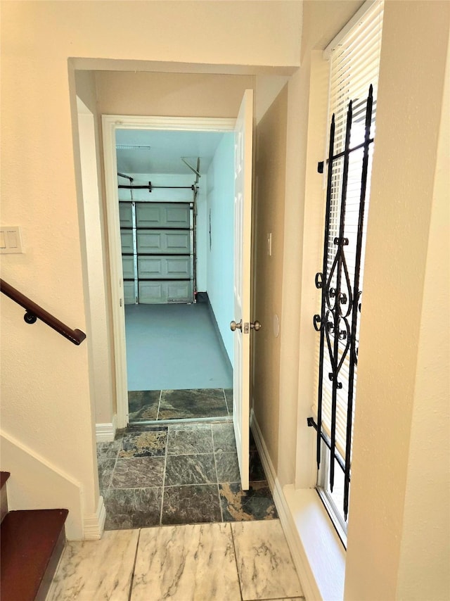 12325 Ridgeside Dr, Houston, TX 77072 - hallway with baseboards and stone finish flooring
