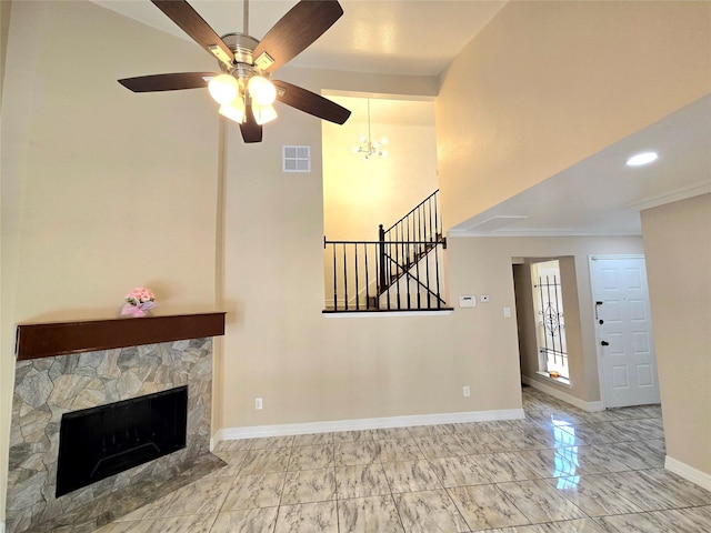 12325 Ridgeside Dr, Houston, TX 77072 - unfurnished living room with baseboards, a ceiling fan, a stone fireplace, stairway, and marble finish floors