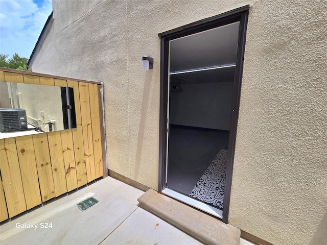 12325 Ridgeside Dr, Houston, TX 77072 - entrance to property featuring stucco siding and cooling unit