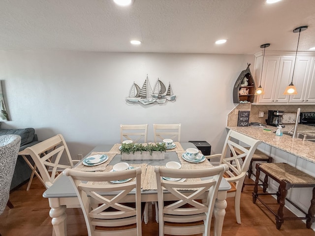 7310 Seawall Blvd Unit 205, Galveston, TX 77551 - dining space featuring a textured ceiling and recessed lighting