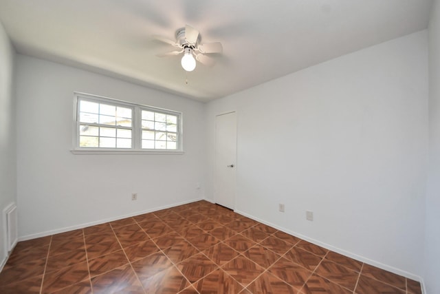 1409 N Park Ridge Dr, Deer Park, TX 77536 - spare room with a ceiling fan and baseboards