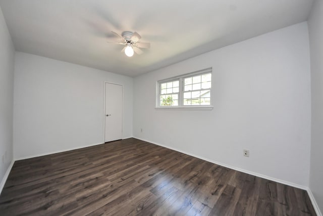 1409 N Park Ridge Dr, Deer Park, TX 77536 - empty room featuring dark wood-style flooring, ceiling fan, and baseboards