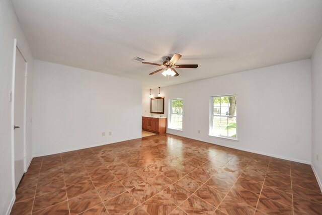 1409 N Park Ridge Dr, Deer Park, TX 77536 - unfurnished room with a ceiling fan and baseboards