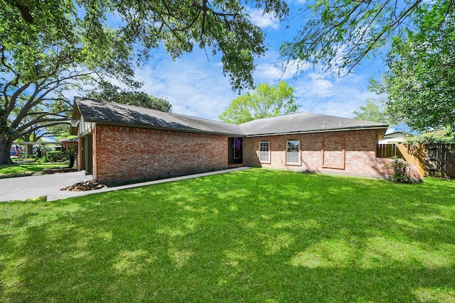 1409 N Park Ridge Dr, Deer Park, TX 77536 - rear view of property with brick siding and a garage