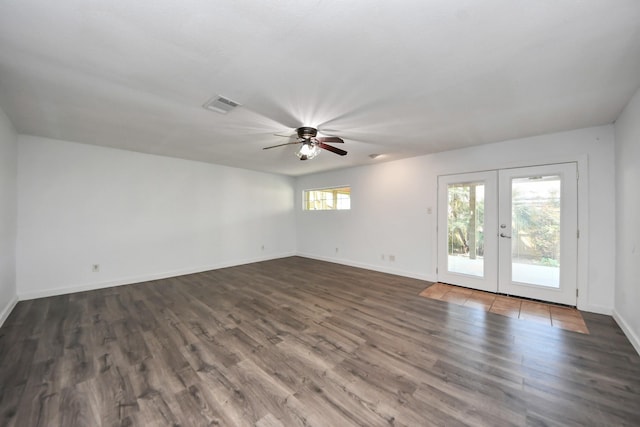 1409 N Park Ridge Dr, Deer Park, TX 77536 - empty room featuring french doors, ceiling fan, dark wood-type flooring, and baseboards