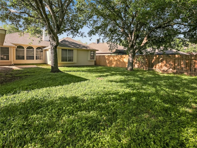 view of yard featuring fence