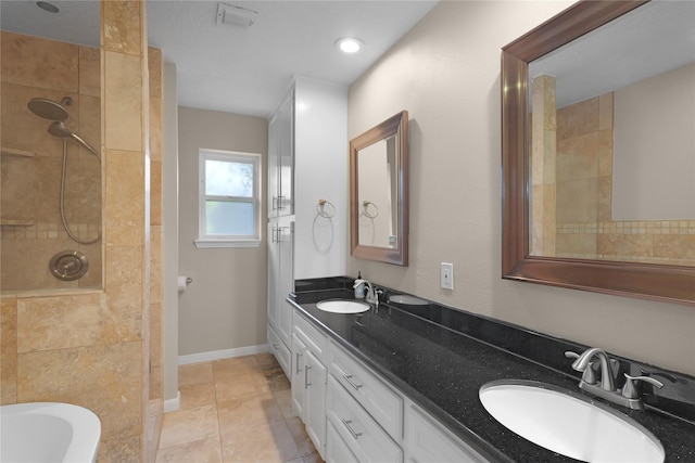 bathroom with a walk in shower, double vanity, a tub, and a sink