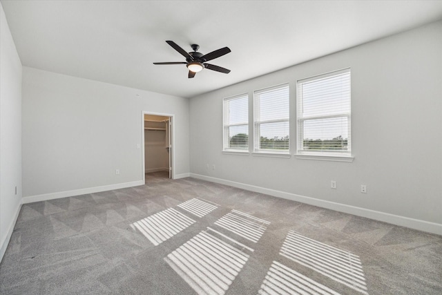 6804 Westview Dr Unit 1407, Houston, TX 77055 - unfurnished bedroom featuring a ceiling fan, a closet, carpet, baseboards, and a spacious closet