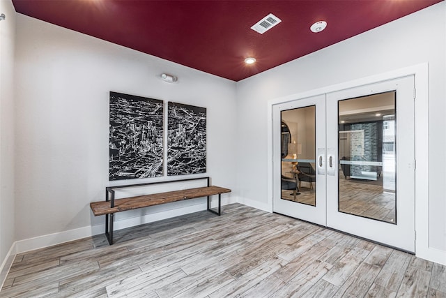 6804 Westview Dr Unit 1407, Houston, TX 77055 - unfurnished room with baseboards, french doors, visible vents, and wood finished floors