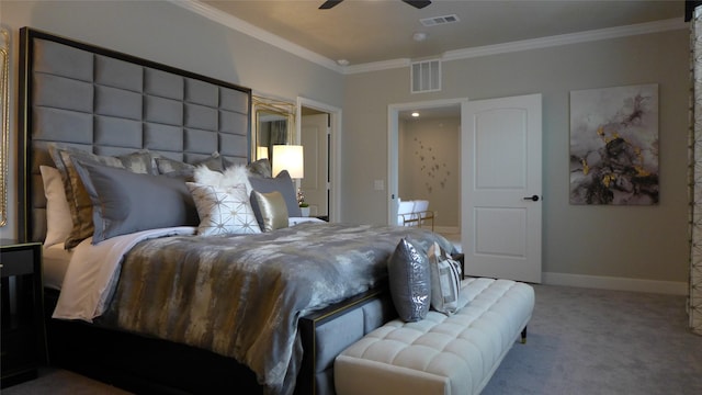 bedroom featuring visible vents, baseboards, crown molding, and carpet floors
