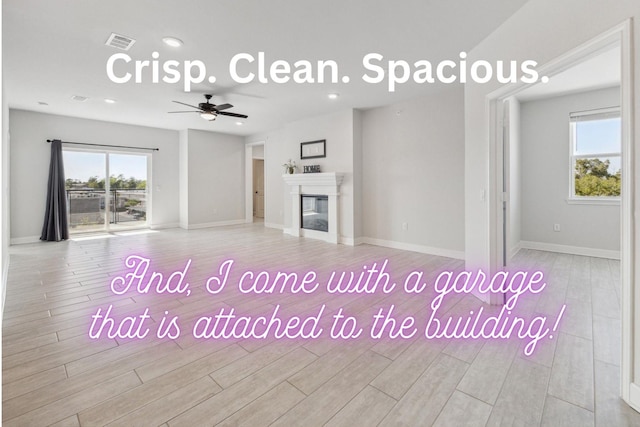 6804 Westview Dr Unit 1407, Houston, TX 77055 - unfurnished living room featuring baseboards, a ceiling fan, visible vents, and wood finished floors