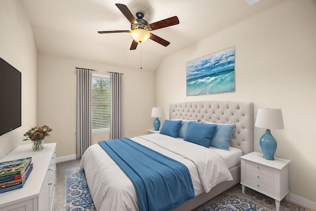 bedroom featuring a ceiling fan, baseboards, and vaulted ceiling