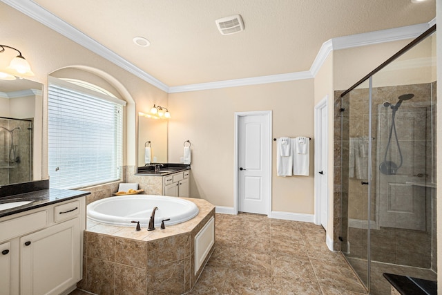 full bathroom featuring ornamental molding, a garden tub, and a stall shower
