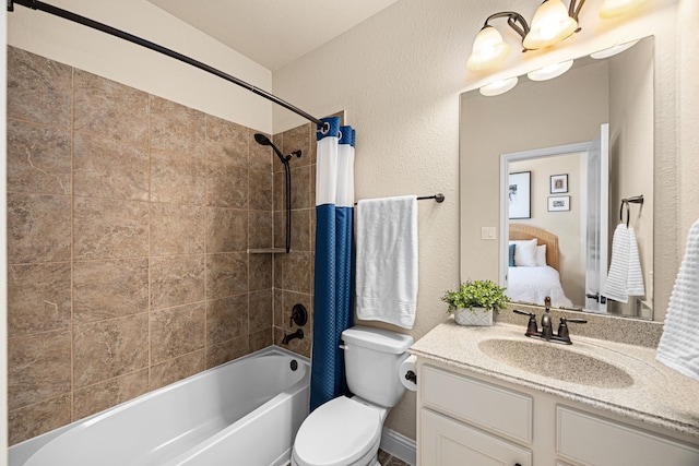 bathroom with vanity, toilet, ensuite bathroom, shower / bath combo with shower curtain, and a textured wall