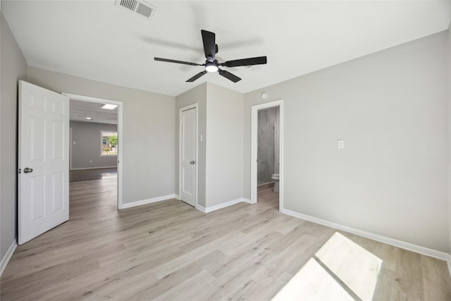 5206 Willow Glen Dr, Houston, TX 77033 - unfurnished bedroom featuring visible vents, light wood-style flooring, and baseboards