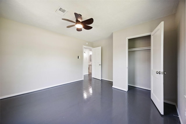 5206 Willow Glen Dr, Houston, TX 77033 - unfurnished bedroom with a closet, baseboards, a ceiling fan, visible vents, and finished concrete floors