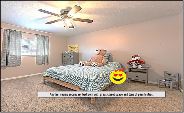 411 Senna Ave, League City, TX 77573 - carpeted bedroom featuring baseboards, a ceiling fan, and a textured ceiling