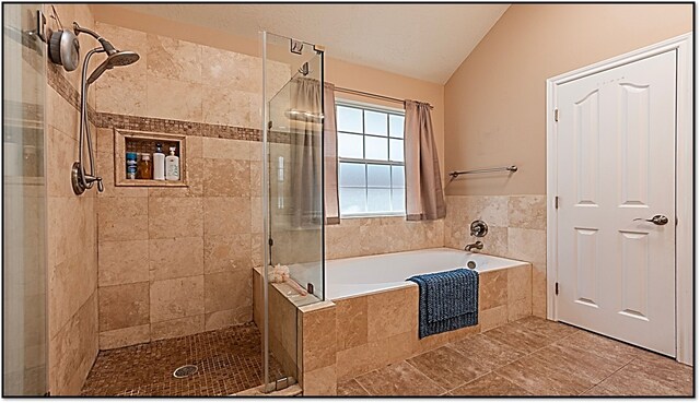 411 Senna Ave, League City, TX 77573 - bathroom with vaulted ceiling, a garden tub, and a stall shower