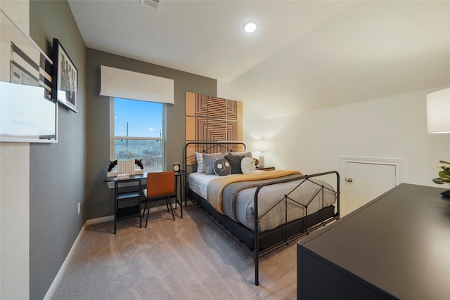bedroom with visible vents, light colored carpet, and baseboards