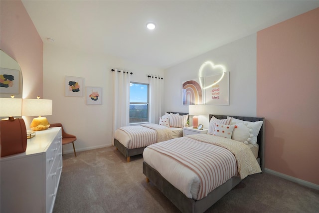 bedroom featuring baseboards and carpet