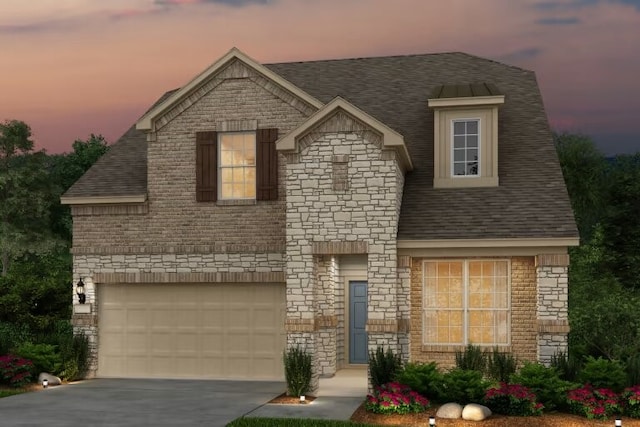 view of front of house with concrete driveway, a shingled roof, stone siding, and an attached garage