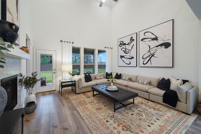 26723 Grandiflora Dr, Magnolia, TX 77355 - living area featuring wood finished floors, a towering ceiling, and ceiling fan