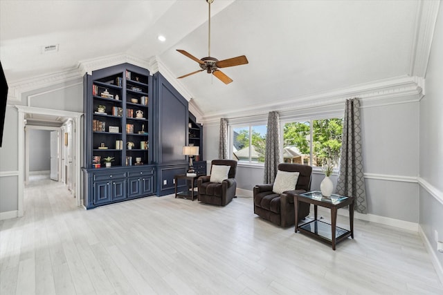 sitting room with vaulted ceiling, light wood-style flooring, a ceiling fan, crown molding, and visible vents