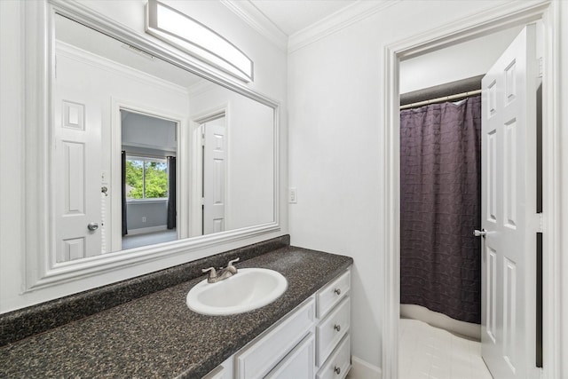 bathroom featuring crown molding, vanity, and a shower with curtain