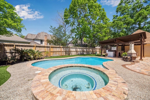 view of pool with a patio area, a fenced backyard, outdoor dry bar, an in ground hot tub, and a fenced in pool