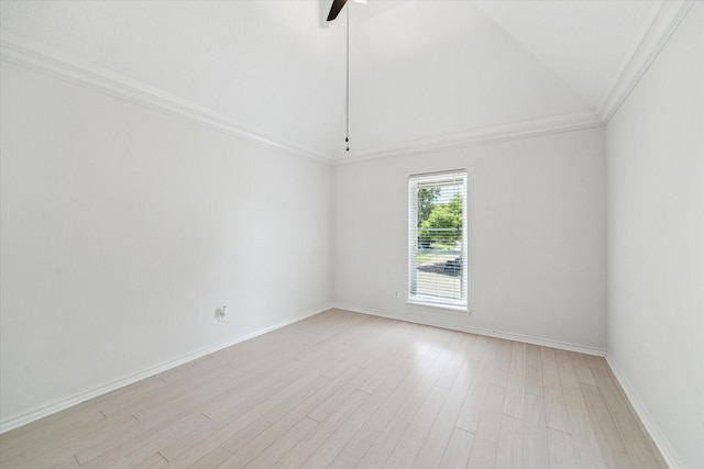spare room with crown molding, ceiling fan, light wood-style flooring, lofted ceiling, and baseboards