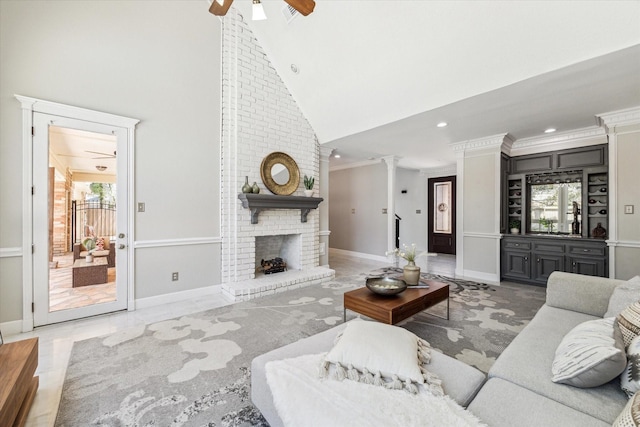 living room featuring high vaulted ceiling, ceiling fan, recessed lighting, and a healthy amount of sunlight