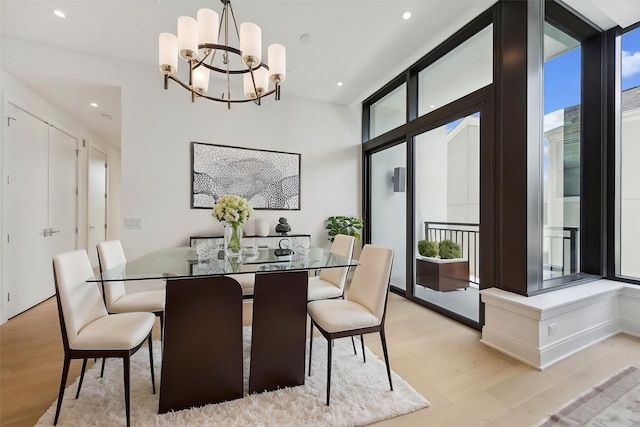 2323 W Main St Unit 305, Houston, TX 77098 - dining space with light wood-style flooring, a chandelier, healthy amount of natural light, and recessed lighting