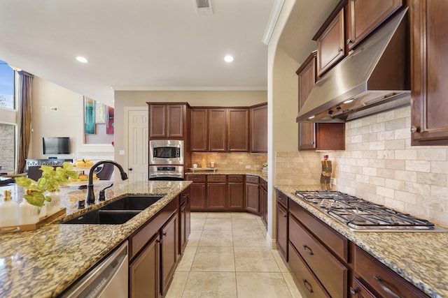 3203 Round Meadow Ln, Missouri City, TX 77459 - kitchen with visible vents, under cabinet range hood, a sink, stainless steel appliances, and backsplash