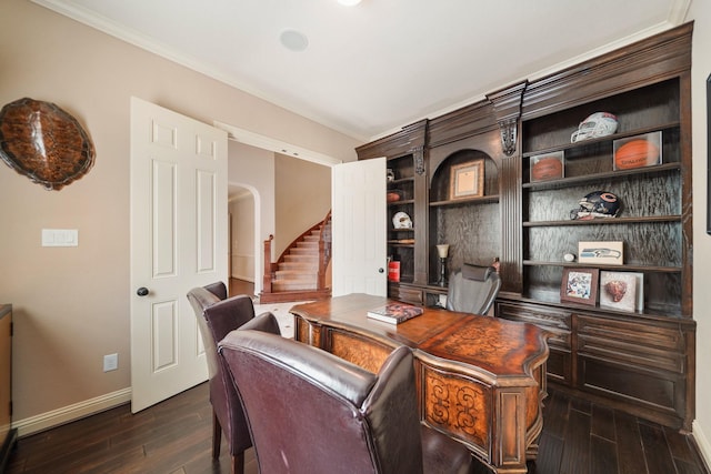 3203 Round Meadow Ln, Missouri City, TX 77459 - home office with baseboards, built in shelves, arched walkways, dark wood-style flooring, and crown molding