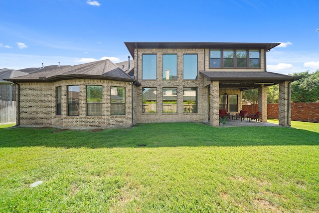 3203 Round Meadow Ln, Missouri City, TX 77459 - back of house featuring a patio, brick siding, fence, and a lawn