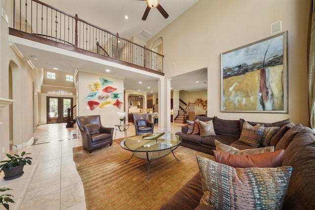 3203 Round Meadow Ln, Missouri City, TX 77459 - living area featuring light tile patterned floors, french doors, a high ceiling, and ceiling fan