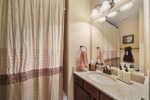 3203 Round Meadow Ln, Missouri City, TX 77459 - bathroom featuring visible vents, a notable chandelier, and vanity