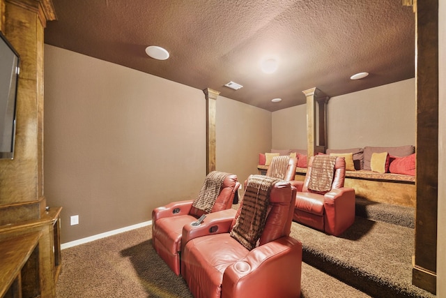 3203 Round Meadow Ln, Missouri City, TX 77459 - carpeted home theater room with visible vents, baseboards, ornate columns, and a textured ceiling