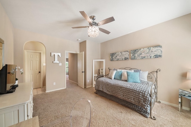 3203 Round Meadow Ln, Missouri City, TX 77459 - bedroom featuring light carpet, ceiling fan, and baseboards